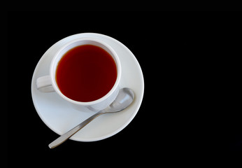Herbal tea in a white mug on a black background. Suitable for advertising backgrounds and mockups