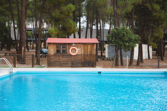 Outdoor Pool With A Lifeguard In A Hut