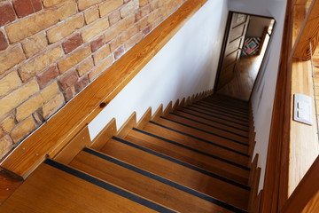 Wooden staircase in coworking space, top view