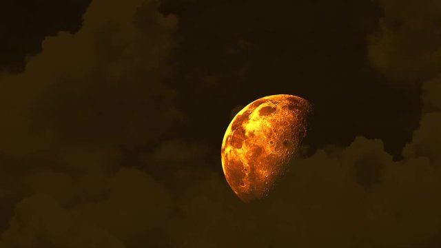 half blood moon rise on the night sky and orange cloud moving pass