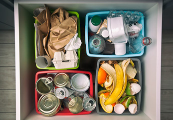 The four different container for sorting garbage. For plastic, paper, metal and organic waste