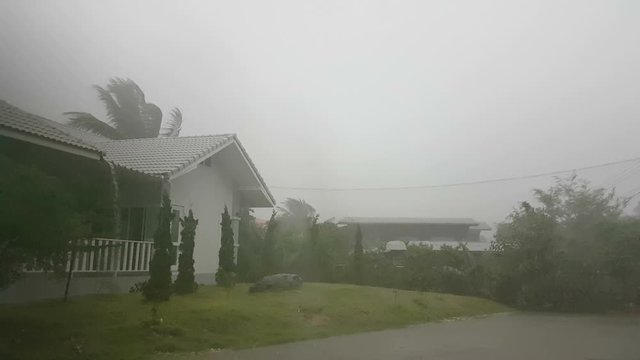 hard rain outside a white house, Thailand