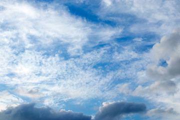 Naklejka na ściany i meble White clouds against blue sky on day time, for a background.