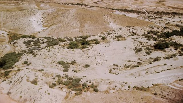 Drone flies over the desert Negev and move camera down