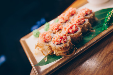 Large set of Sushi Rolls Warm Ebi Sake Unagi Spring. A lot assortment Philadelphia roll Dishes from Japanese raw fish  in one plate in traditional restaurant. Japan food menu service