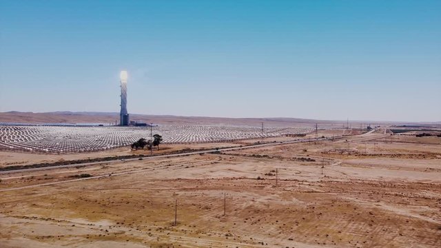 Flying with rising up to direction the solar power station Ashalim in Negev desert