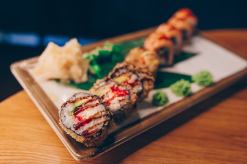 Large set of Sushi Rolls Warm Ebi Sake Unagi Spring. A lot assortment Philadelphia roll Dishes from Japanese raw fish  in one plate in traditional restaurant. Japan food menu service