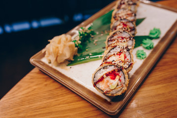 Large set of Sushi Rolls Warm Ebi Sake Unagi Spring. A lot assortment Philadelphia roll Dishes from Japanese raw fish  in one plate in traditional restaurant. Japan food menu service