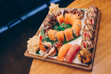 Large set of Delicious sushi rolls view from above Flat Lay . A lot assortment Philadelphia roll Dishes from Japanese raw fish  in one plate in traditional restaurant. Japan food menu service