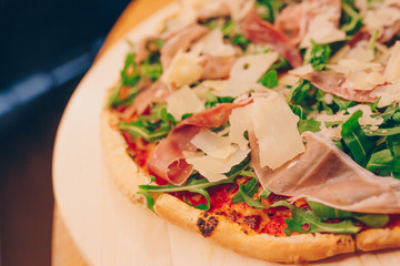 Close-Up Pizza bacon barbeque pizza cheese, salami, Tomatoes, pepper, Spices and Fresh Basil. Italian pizza at restaurant  Eating and leisure concept.lifestyle Organic Gourmet Concept banner