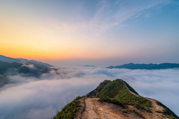Fototapeta na wymiar Ta Xua is a famous mountain range in northern Vietnam. All year round, the mountain rises above the clouds creating cloud inversions.