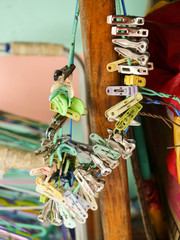 A variety of old plastic clothes peg