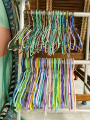Many old hangers Made from wire and plastic