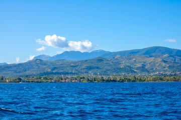 Hilly Coast on a Sunny Summer Day and Clouds