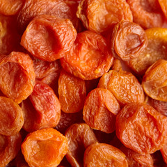 Dried apricots background. Heap of dry apricot fruits
