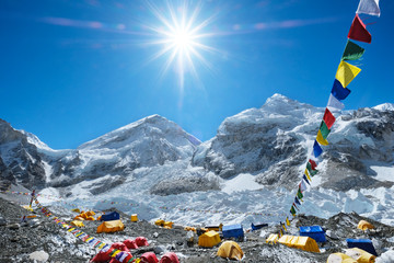 Orang,  red and blue  tents in the Everest base camp. Mountain peak Everest. Highest mountain in the world. National Park, Nepal. - obrazy, fototapety, plakaty