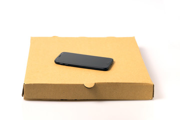 Smartphone on brown food delivery box