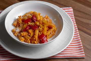 pasta with pepper cream and pieces of red and yellow pepper