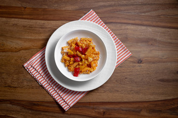 pasta with pepper cream and pieces of red and yellow pepper