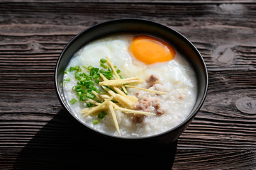 Rice gruel or congee with egg ,pork and vegetable