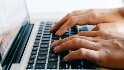 Fototapeta na wymiar hands typing on a keyboard