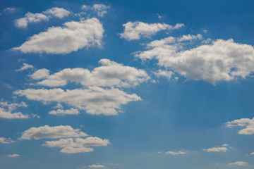Bright blue sky with white clouds. Sunny day