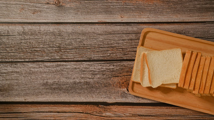 Fresh bread on wooden table. Top view with space for your text