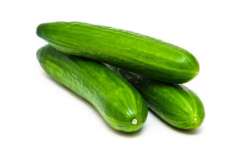 Three greenhouse green, smooth cucumbers on a white background in the form of a pyramid, triangle, a bunch. Greenhouse cucumbers from above and in front. Cucumbers in macro, butt, tails of  cucumbers
