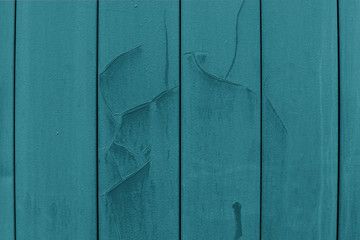Old wall covering, metal plates blue emerald green siding with cracked paint and dents. Backdrop background textured effect, beautiful texture