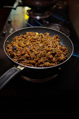 South Indian dish spicy beef fry Kerala, India. side dish ghee rice, appam, parotta, puttu, bread and chappathi, Kerala cuisine ,Buffalo roast / Meat pepper fry with coconut. India spices cooking,