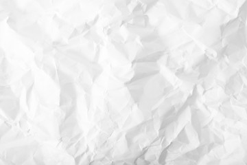Obraz premium Crumpled wrinkled white office paper background, texture of writing paper with wrinkles