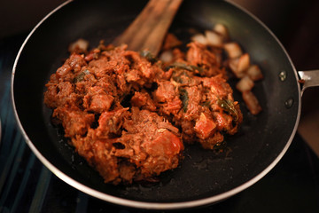 South Indian dish spicy beef fry Kerala, India. side dish ghee rice, appam, parotta, puttu, bread and chappathi, Kerala cuisine ,Buffalo roast / Meat pepper fry with coconut. India spices cooking,