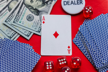 Poker cards and red dices on red background