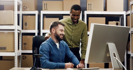 Delivery, mail service. Young people working at the post office using computer.