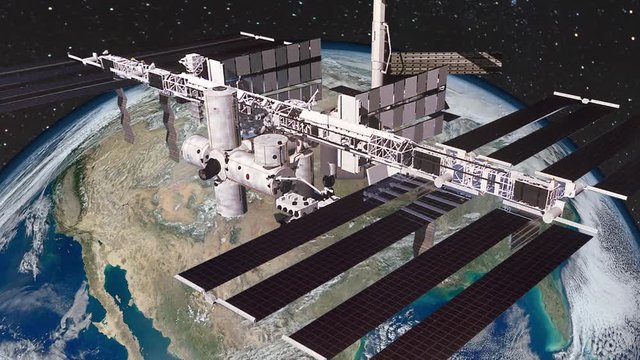 Animation of the International Space Station (ISS) Floating in Orbit above Planet Earth in outer space. Contains public domain image by NASA