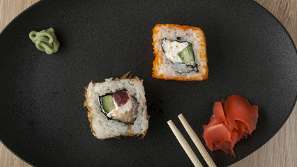 japanese sushi on a black plate