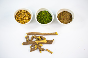 Parsley, coriander, caraway and licorice on a white background