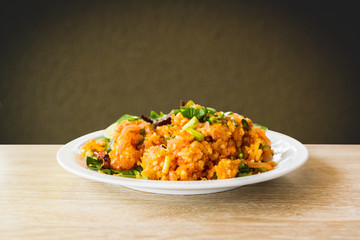 Fermented Pork and Crisp Rice Salad or Yam Naem Khao Tod Recipe,Thai food concept.Blurbackground in brown