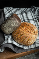 ssortment of fresh organic bread . Assorted bread with flour.