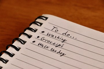 To do list written on paper notebook 