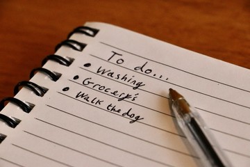 'To do' list written on paper notebook with pen 