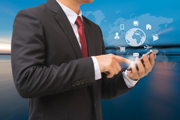 Businessman in the suit is using smartphone to communication