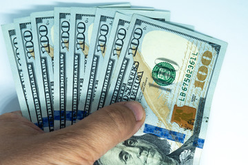 Heap of Dollar Bills on white background. Dollars Closeup Concept. American Dollars Cash Money. One...