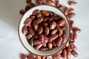 Red beans in a bowl and around
