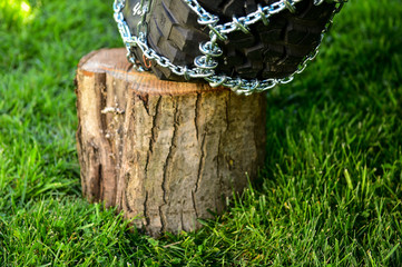 Tire chain for extra traction in mud and snow conditions on an off road vehicle wheel