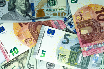 Heap of Dollar and euro Bills on white background. Dollar and euro Closeup Concept. Dollar and euro Cash Money. Banknotes. Cash of Dollar and euro bills, money background.