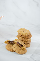 Group of homemade chocolate cookies and space for text on marble background