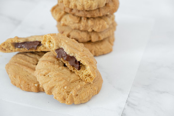 Group of homemade chocolate cookies and space for text on marble background