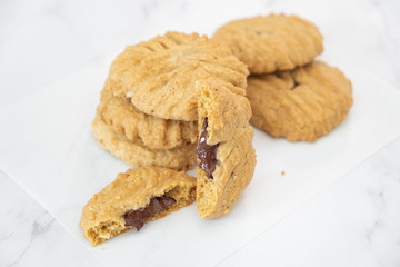 Group of homemade chocolate cookies and space for text on marble background