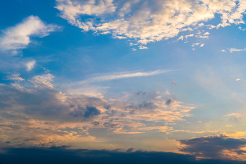 blue sky with golden orange cloud sunset